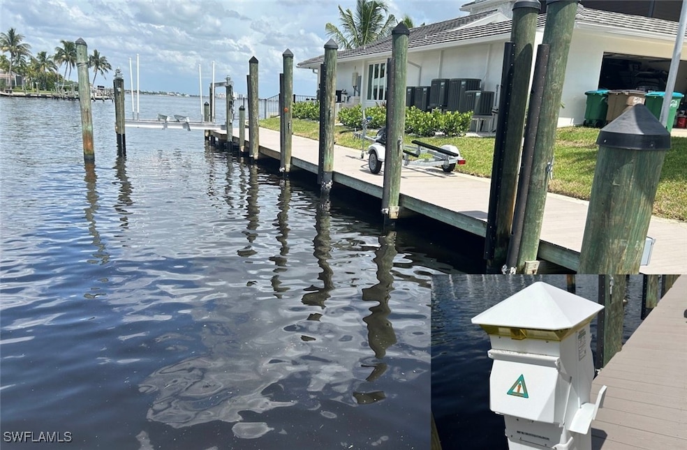 Dock area featuring a water view