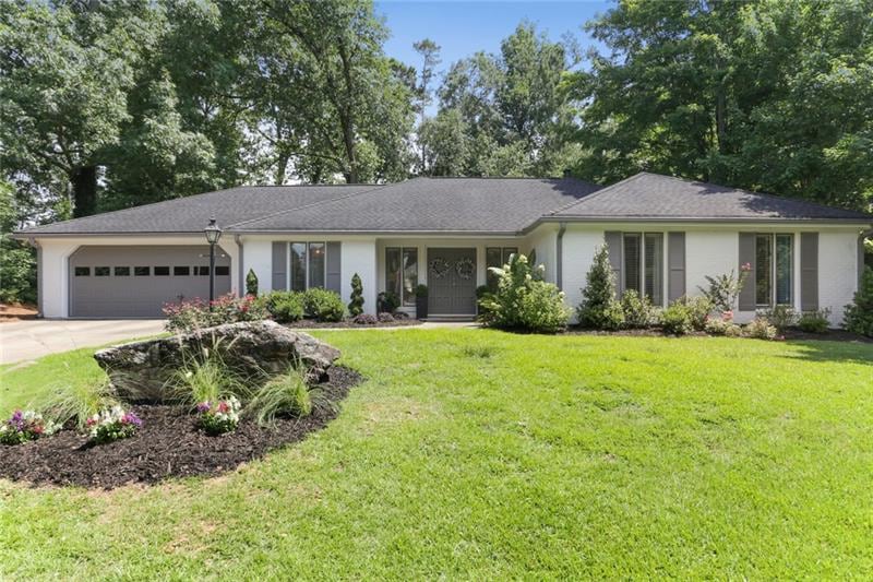 Beautiful 4 bedroom 3 bath white brick home on lar
