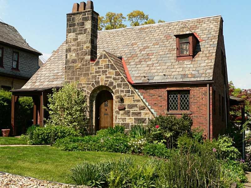 Exterior Front. Stone & brick entry with paladian 