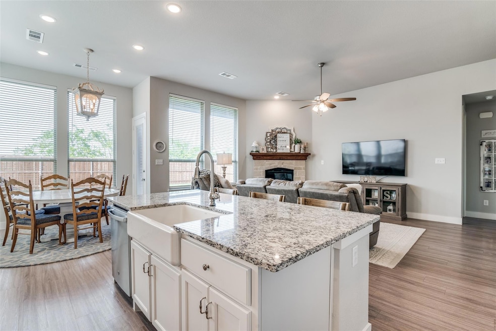 Specious Living open area with Austin Stone Fireplace with Gas Logs!  Room to entertain Family or Friends!!!