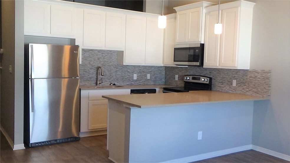 Kitchen with appliances with stainless steel finis