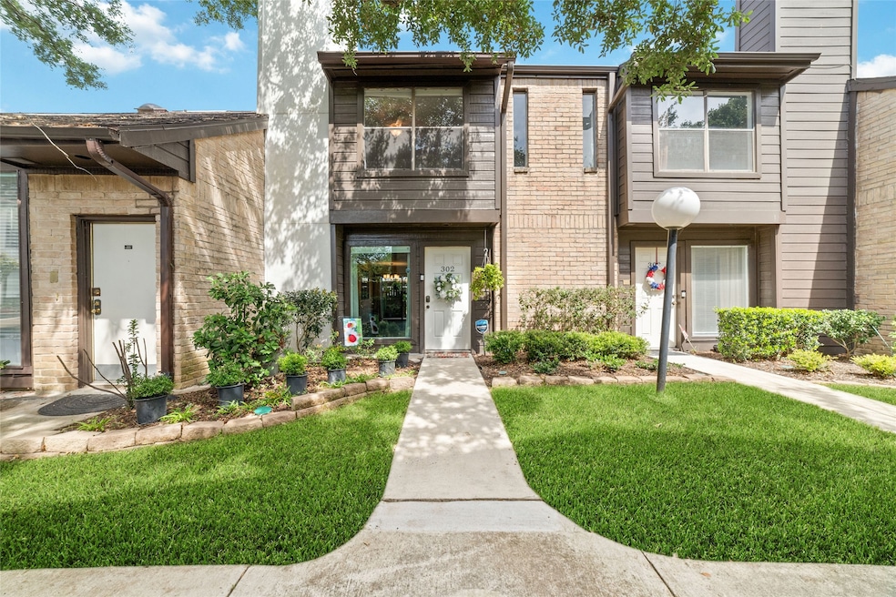 This charming townhouse features a cozy exterior w