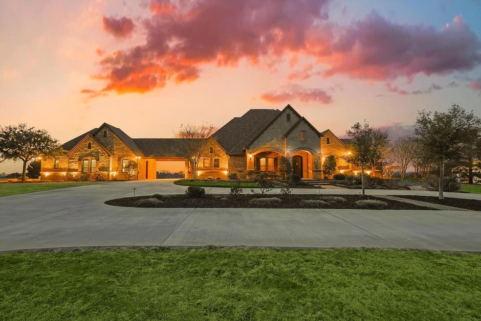 Experience luxurious living in this custom built home with premium upgrades, a circular drive, and an expansive 34-acre property to savor.