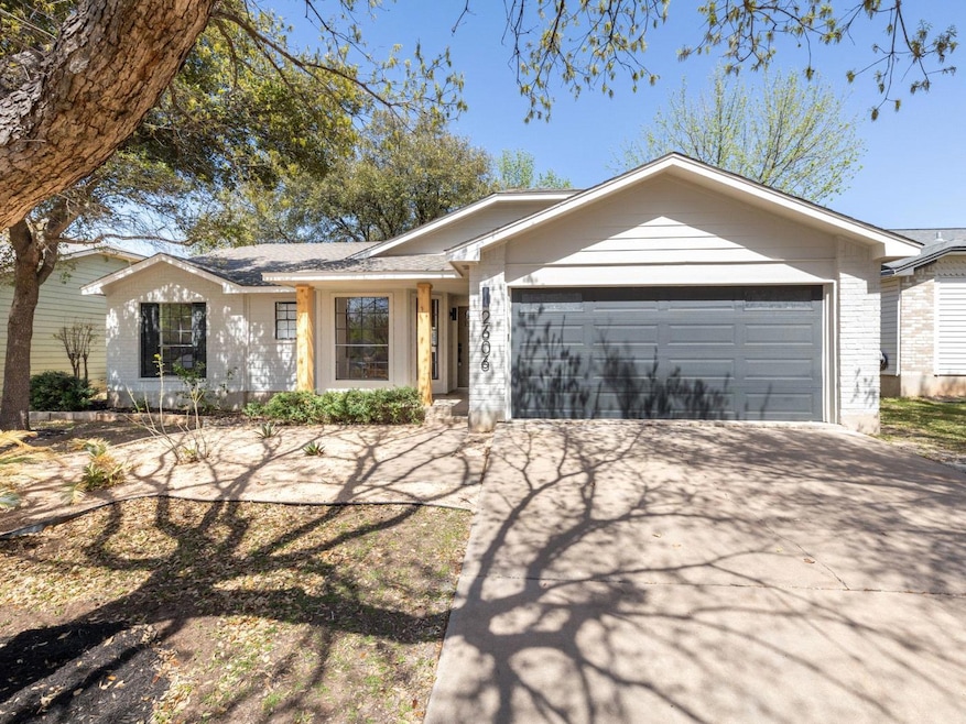 Ranch-style house featuring an attached garage, c