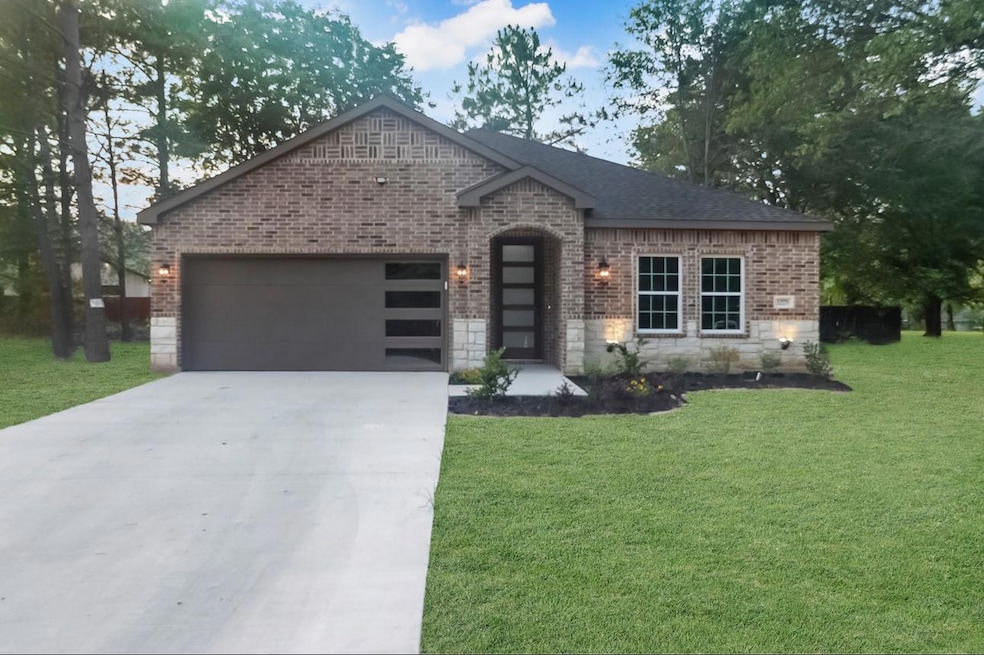 View of front facade with a garage and a front yar