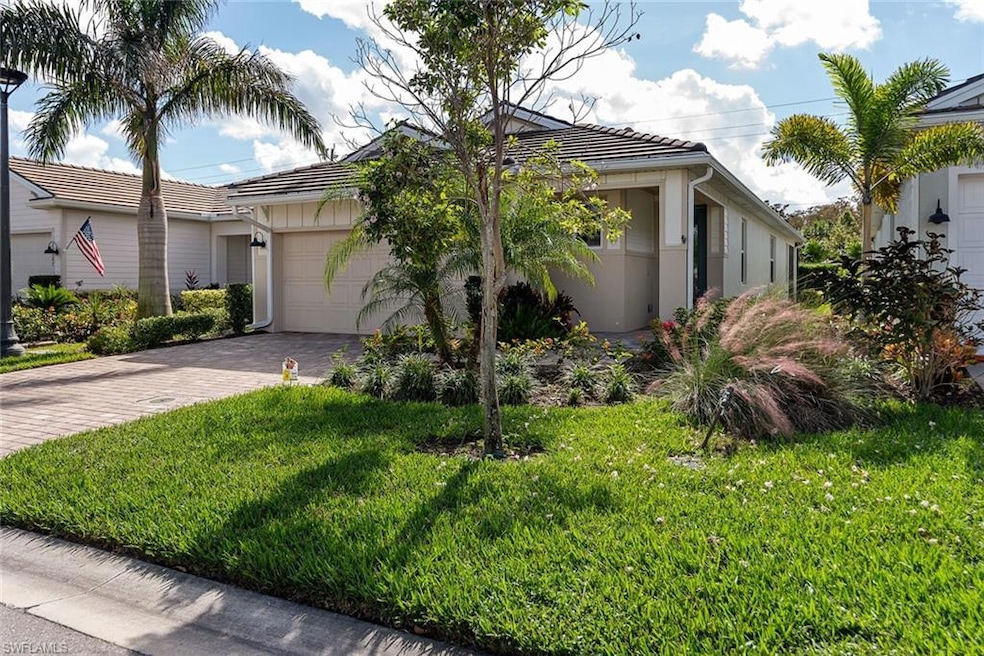 View of front of property with a front yard and a 