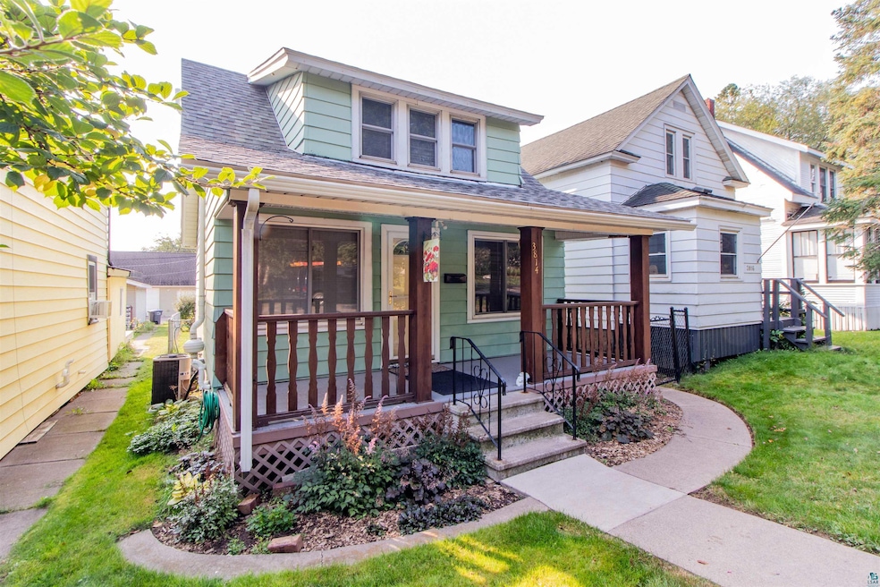 Bungalow featuring central air condition unit, a f