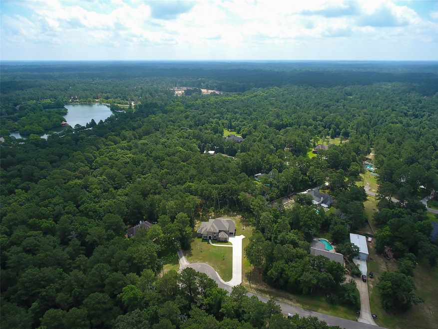 This elevated shot shows the positioning of the home in relation to the street. Come home and enjoy the peace of your private lot.