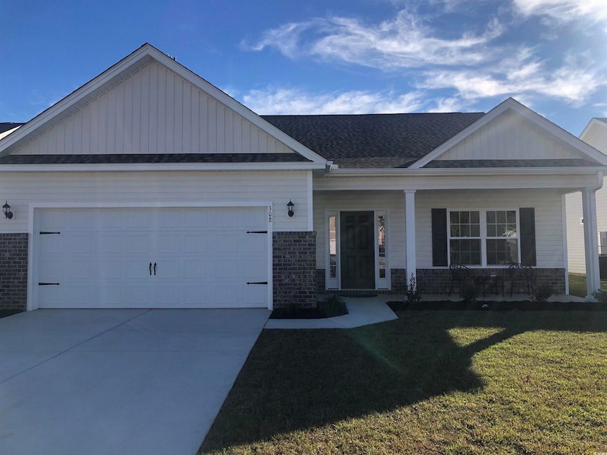 View of front of home with a front yard, a porch, 