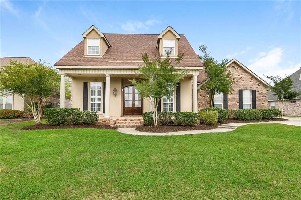 Manicured front lawn on this very well kept Master
