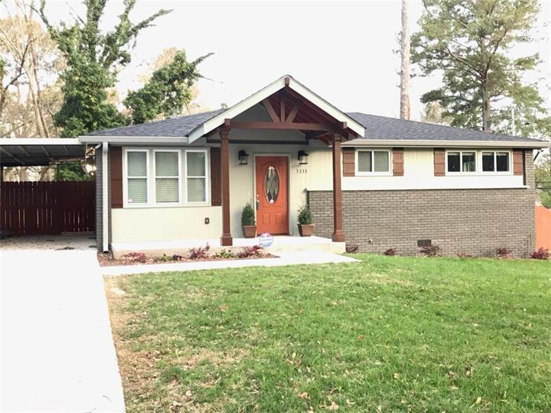 Front of Beautiful grey home with copper and brown