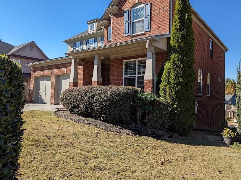 View of front of property with a front yard and a 