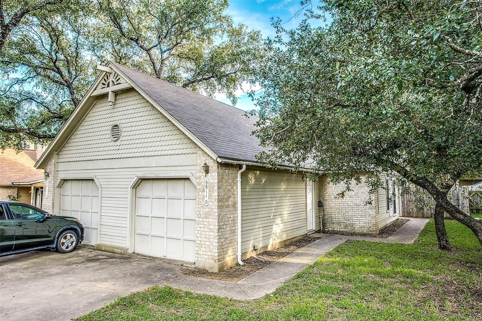Garage featuring driveway