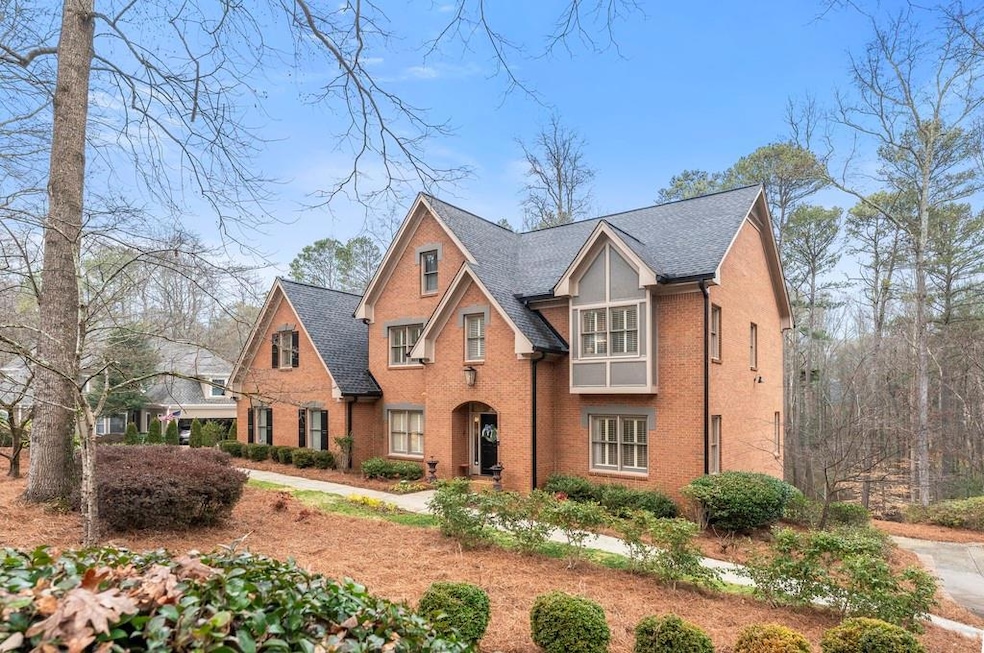 Tudor house featuring brick siding