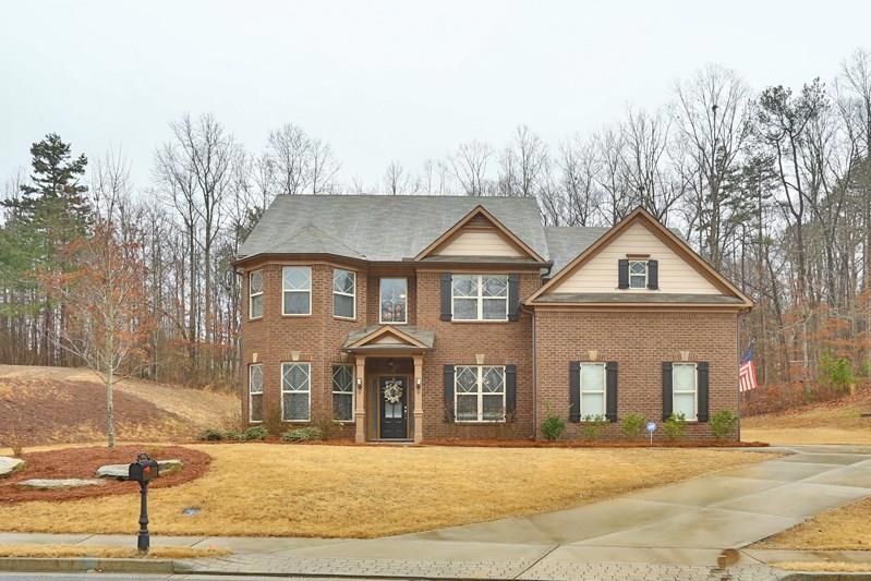 This home sits on a lot wide enough for side entry