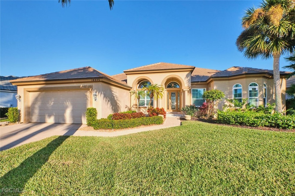 Mediterranean / spanish-style house featuring stucco siding, an attached garage, concrete driveway, and a front lawn