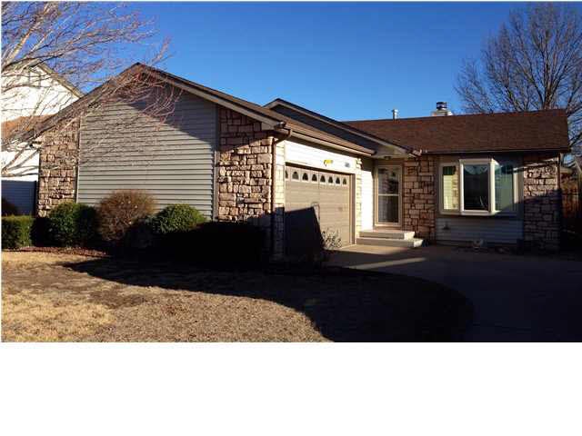 Beautiful partial stone front with side load garag