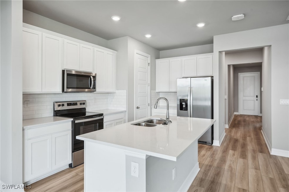 Photos are of a model home with the same floorplan