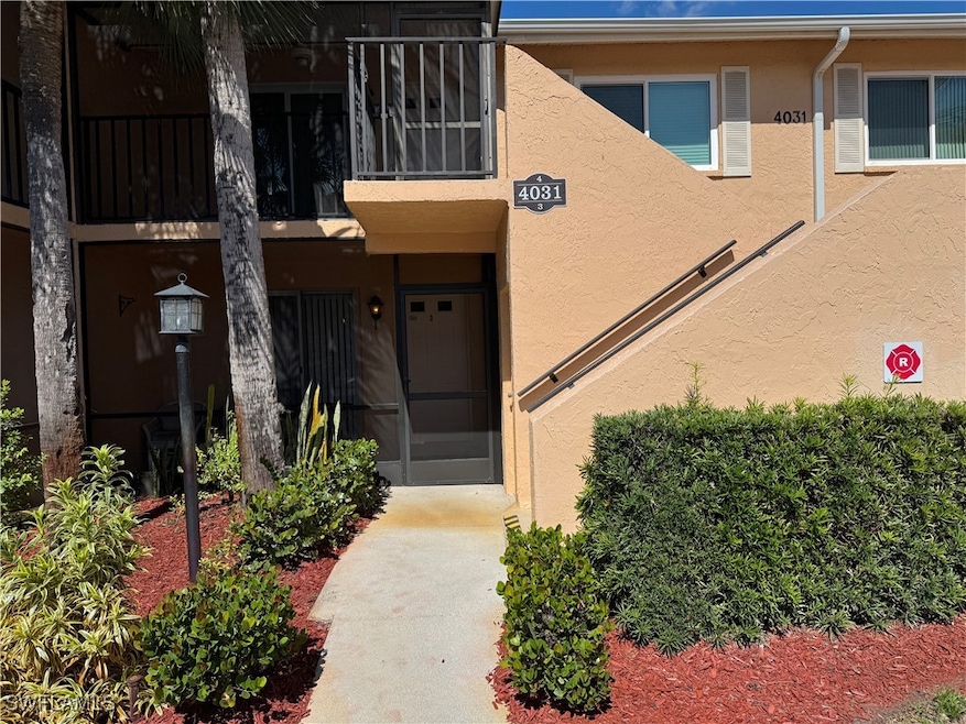 Doorway to property featuring stucco siding