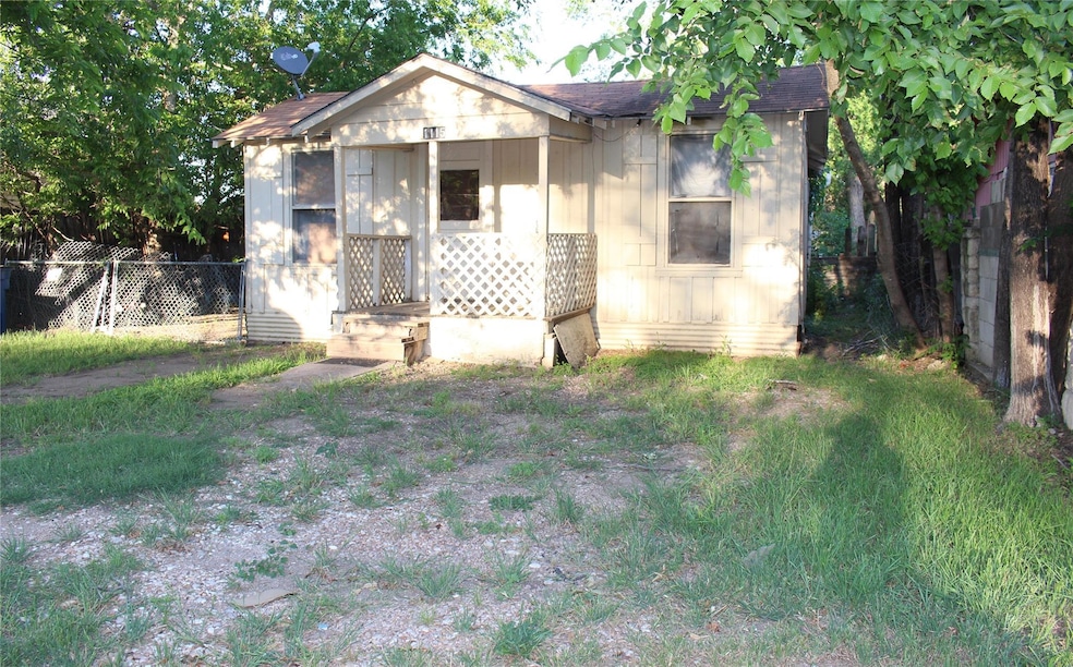 Bungalow-style home with fence and roof with shin