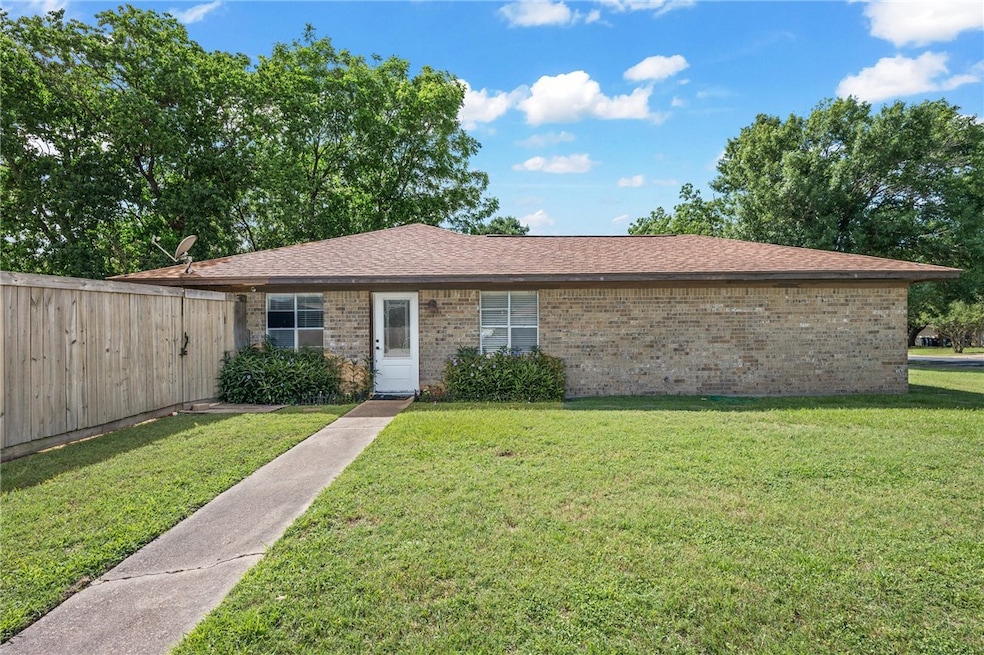 Ranch-style home featuring brick siding and roof w