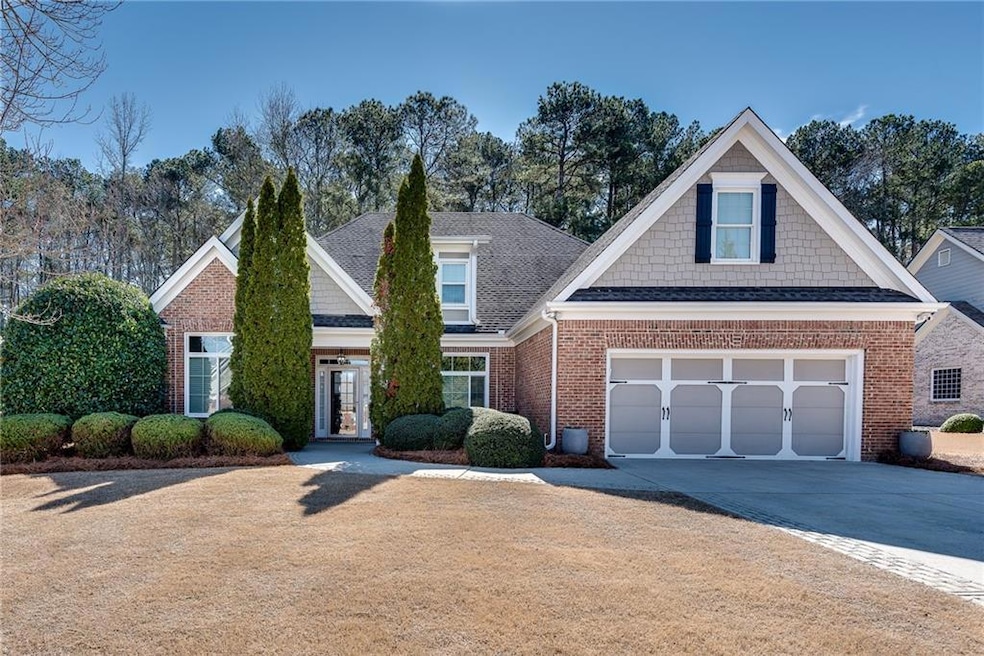 View of front of property featuring concrete drive