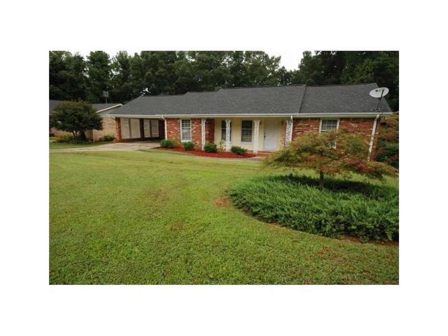 Exterior Front. Beautiful landscaped yard welcomes
