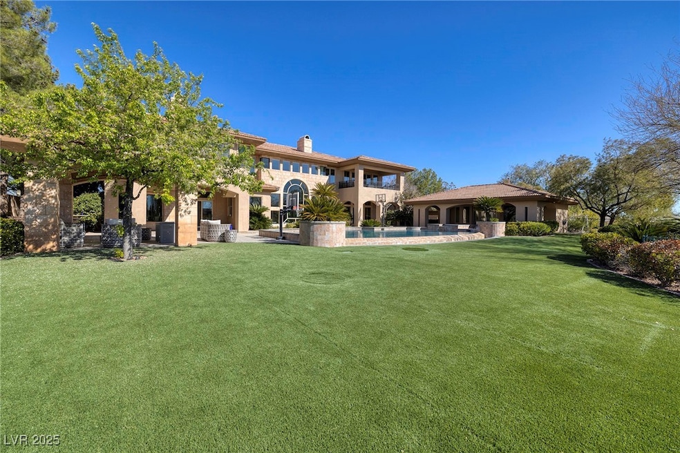 Back of house with a patio area, a lawn, an outdoo
