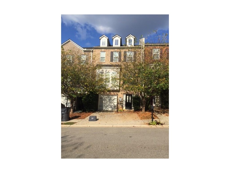 Brick Townhome with large garage and driveway park