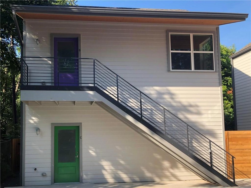 Property entrance featuring fence and a balcony