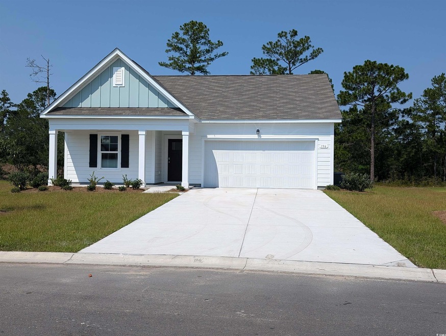 View of front of house featuring a porch, a garage
