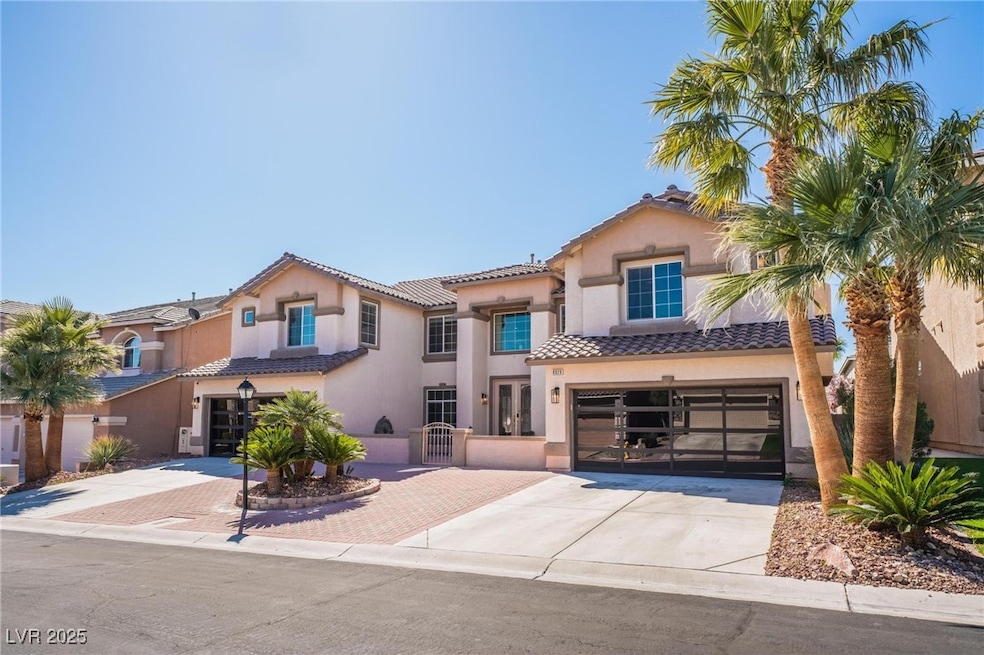Dramatic front with with unique custom garage door