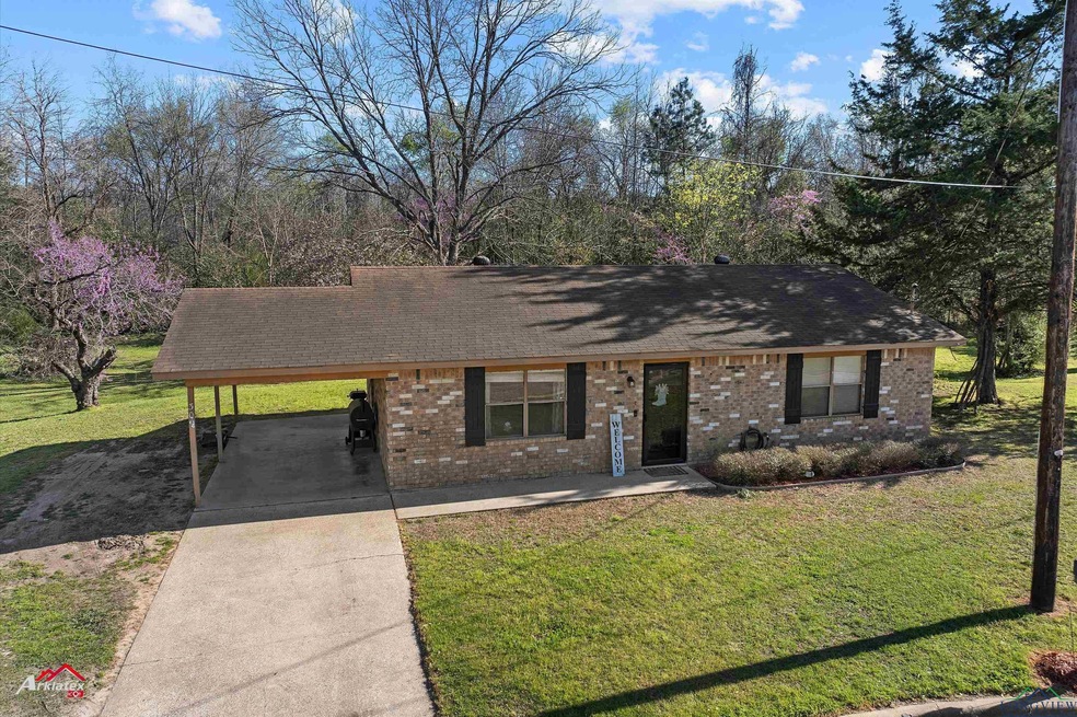 Ranch-style home featuring brick siding, an attach