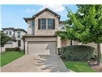 Traditional-style home featuring a garage and con