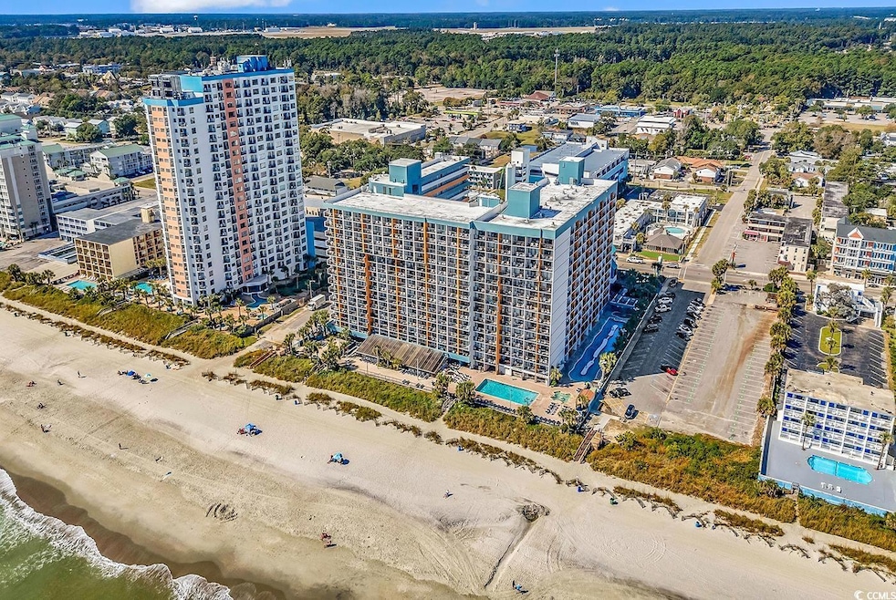 View of urban area featuring a pool and local beach
