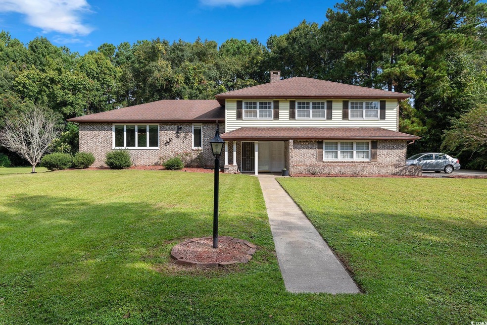 Tri-level home featuring a front yard