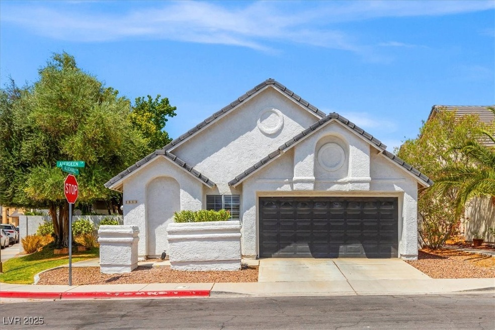 Ranch-style home featuring an attached garage, stu