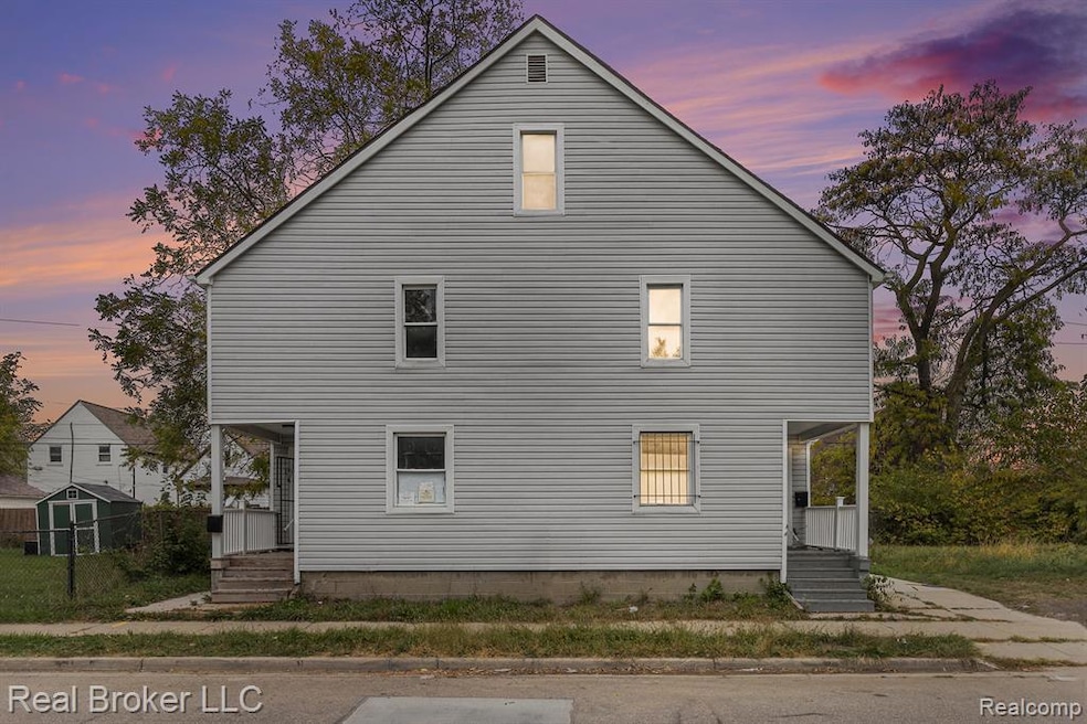 Property exterior at dusk featuring covered porch