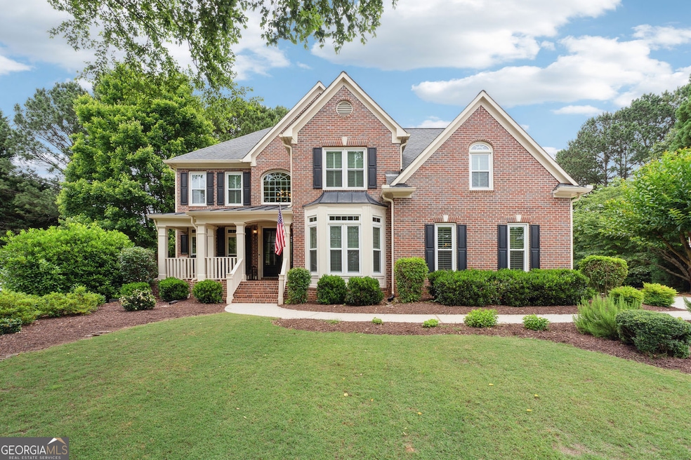 Front view of the home with a professionally landscaped private yard.