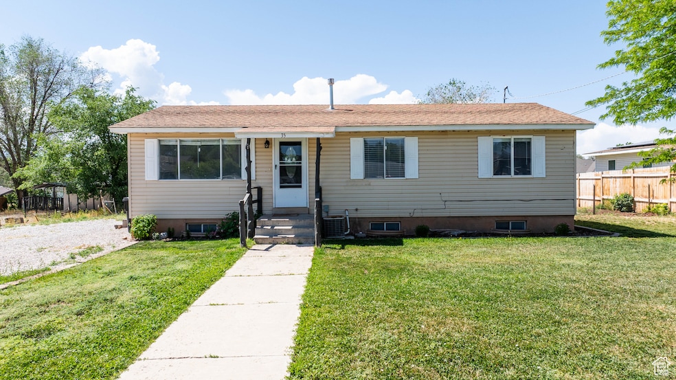 Bungalow-style house featuring central AC unit and crawl space