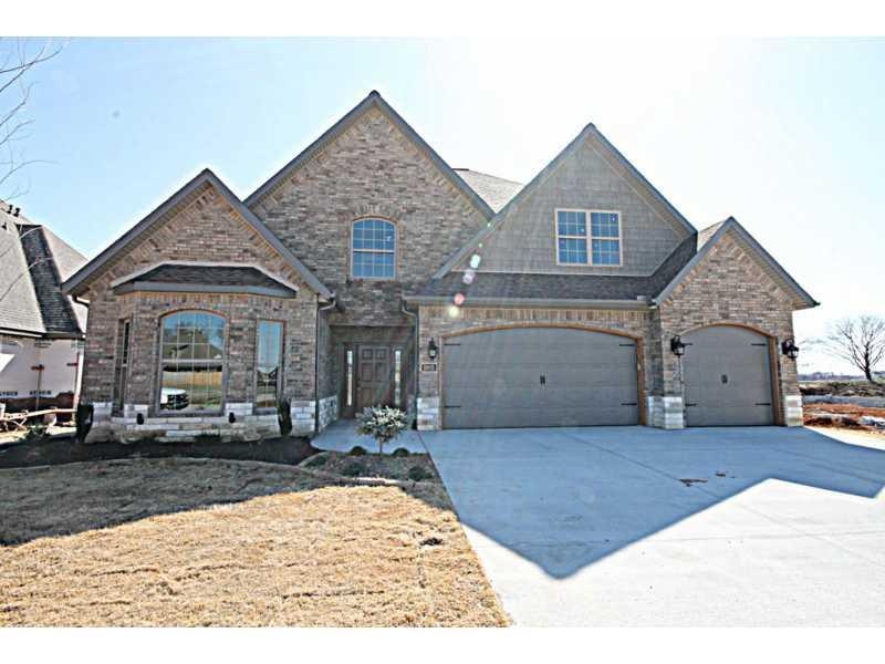 Exterior Front. Stone and brick exterior, landscapped yard with irrigation system
