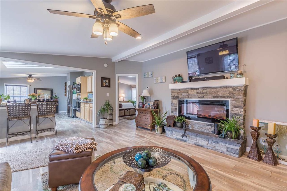 cozy new electric fireplace with stone mantel