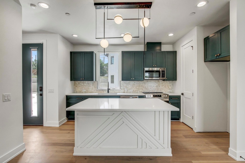 Kitchen featuring a sink, appliances with stainle