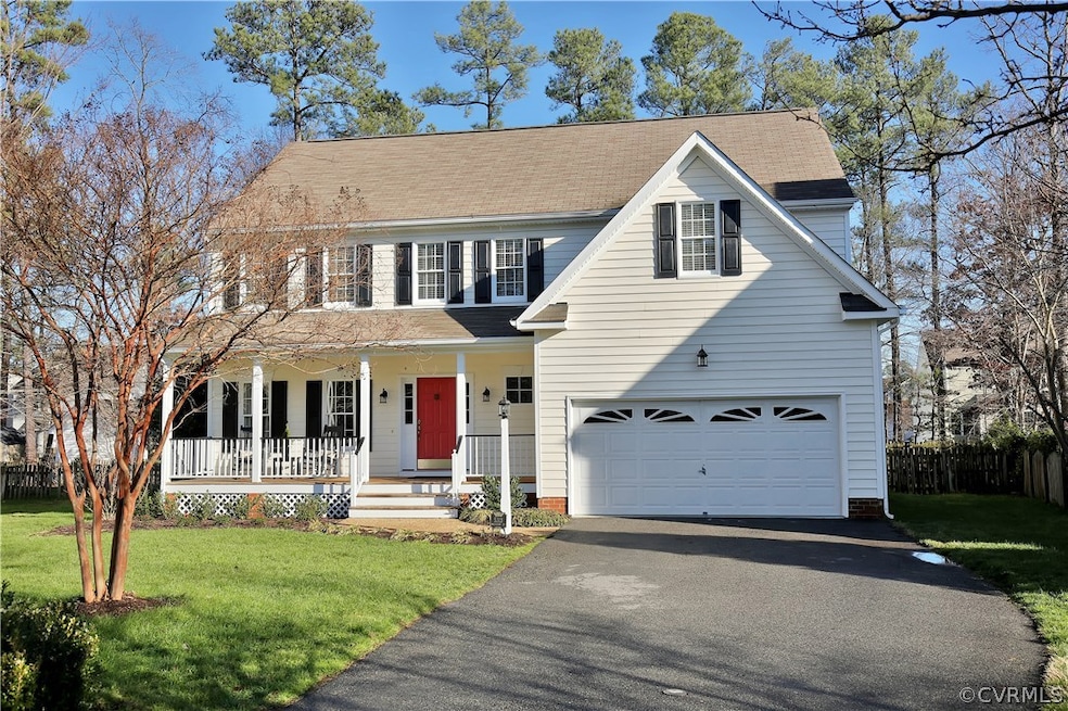 Front view of home with large, country porch.
