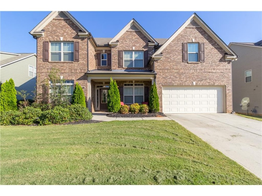 Beautiful Brick front with a shaded porch to sit a