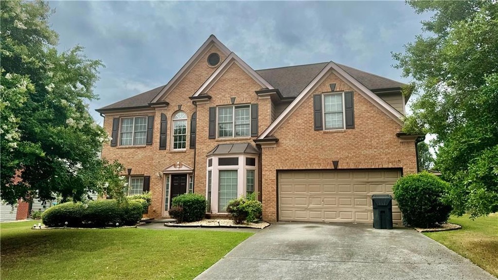 View of front of house featuring a garage and a fr