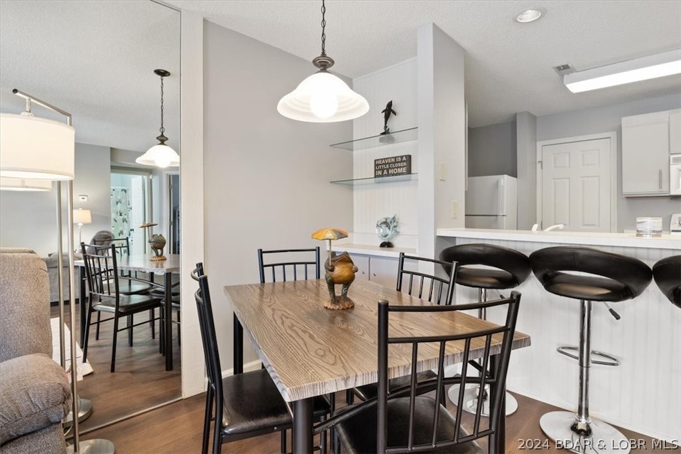 Room for a dining table and cute bar area!