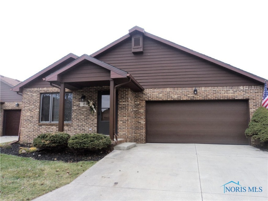 All brick home with freshly painted wooden trim