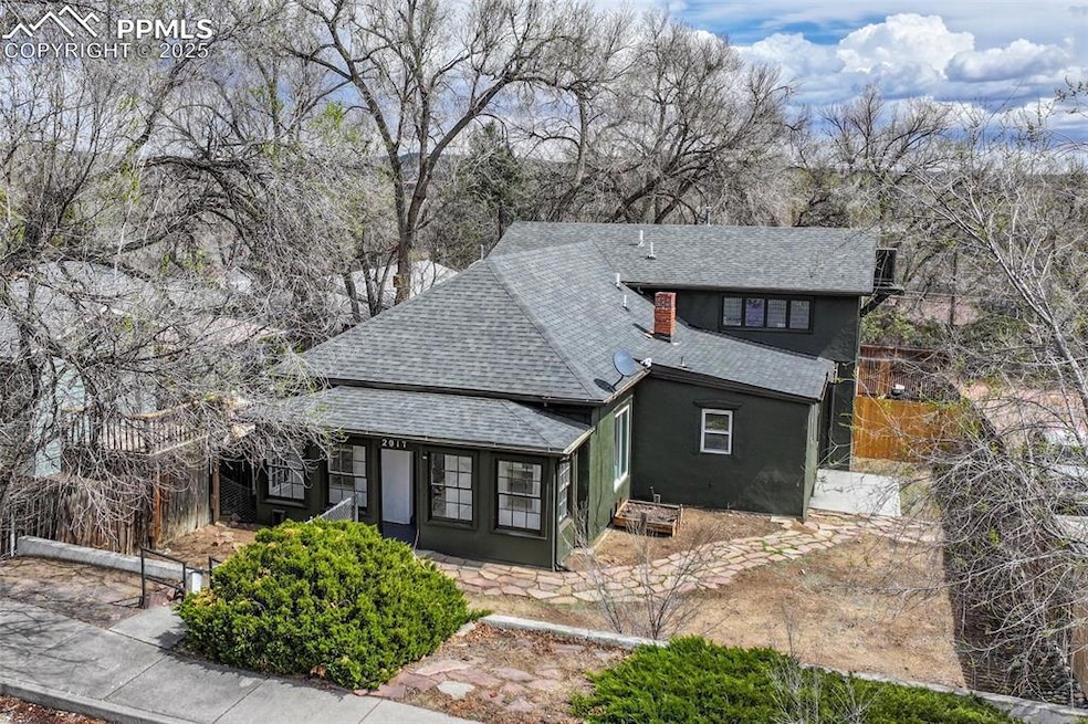 View of front of house featuring a shingled roof a