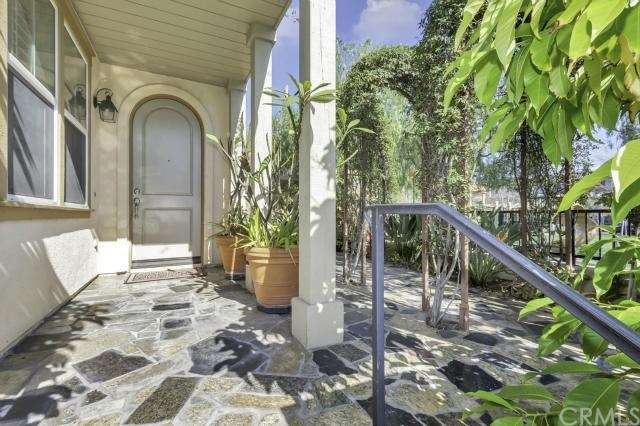 Granite patio leading to private front entry